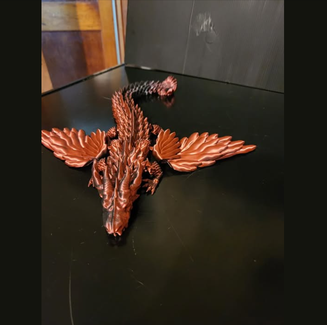 Copper colored 3D printed dragon toy